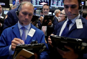 Futures slightly lower as oil prices slip